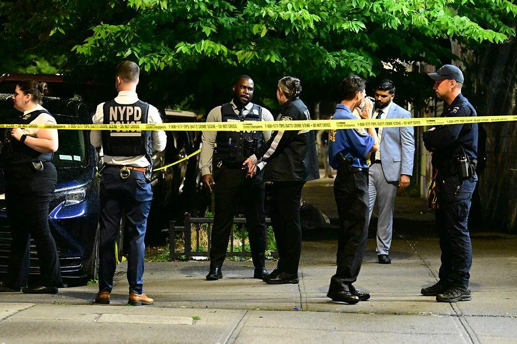 NYPD officers work at the scene after eight people, including four children, were shot in a mass shooting near the intersection of West 30th Street and Surf Avenue in the Coney Island neighborhood of Brooklyn, New York, United States, on July 4, 2026.