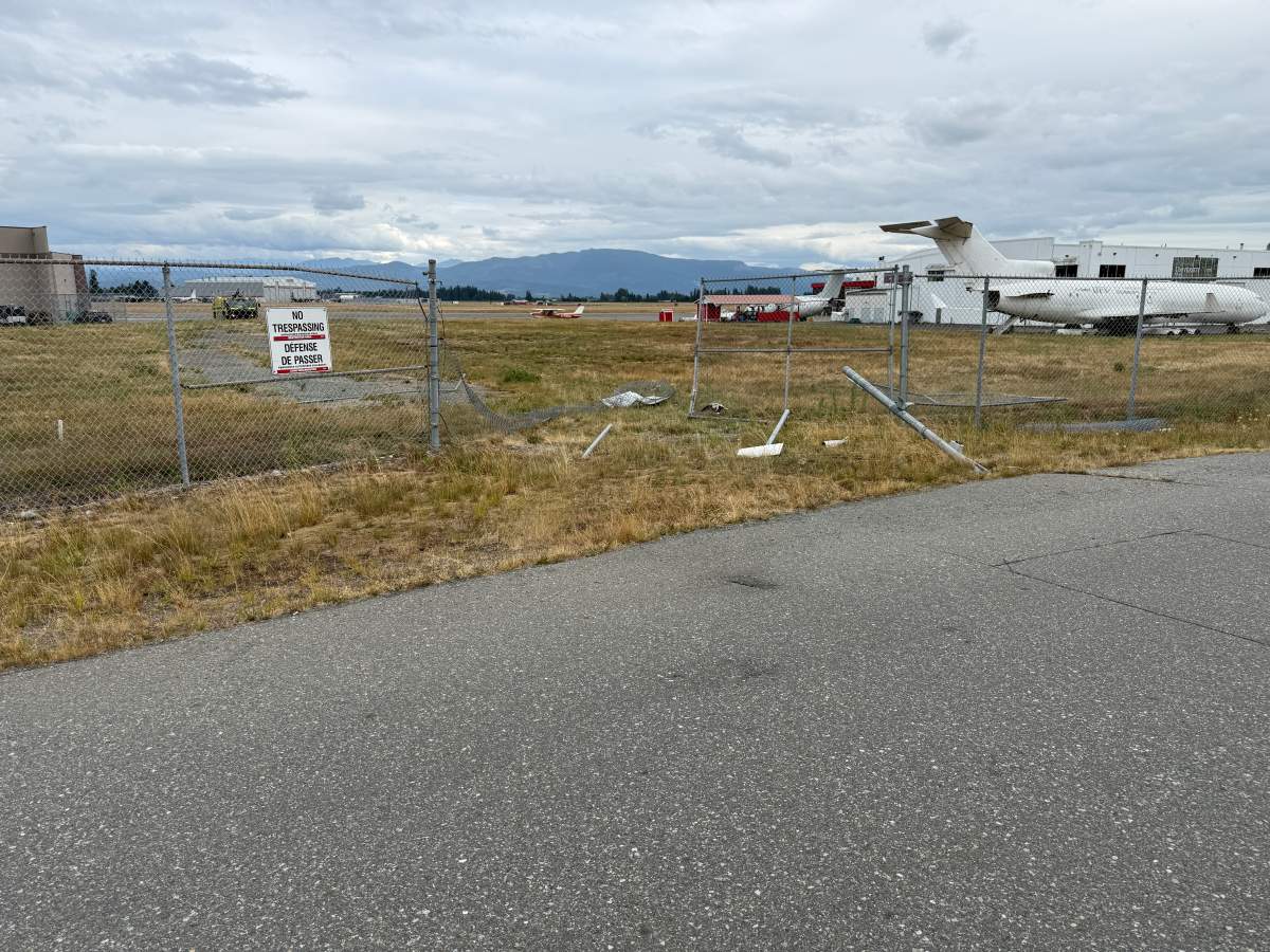 A perimetre fence at Abbotsford International Airport is pictured after a motorhome allegedly crashed through and entered an active runway on July 25.