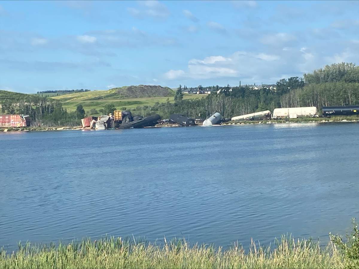Photos from the scene of the derailment show several of the cars, including tanker cars, lying on their side in the water.