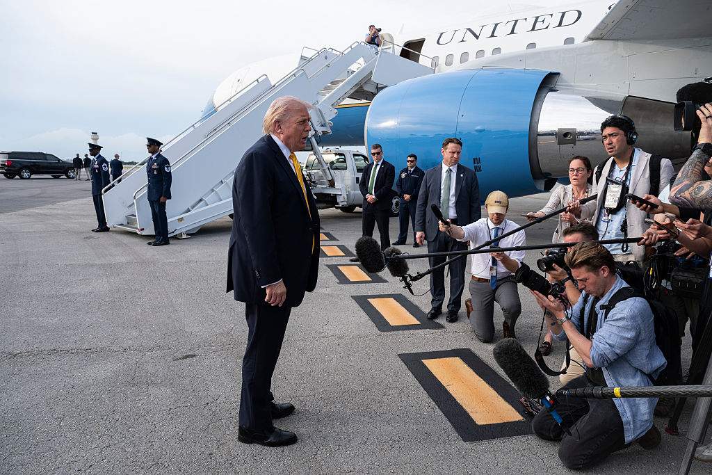 U.S. President Donald Trump speaks to journalists before boarding Air Force One at Palm Beach International Airport on May 2, 2026 in Palm Beach, Florida.