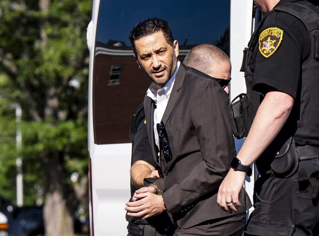 Luciano Frattolin is brought in custody to the Essex County Court in Elizabethtown, New York, Friday, July 24, 2026.