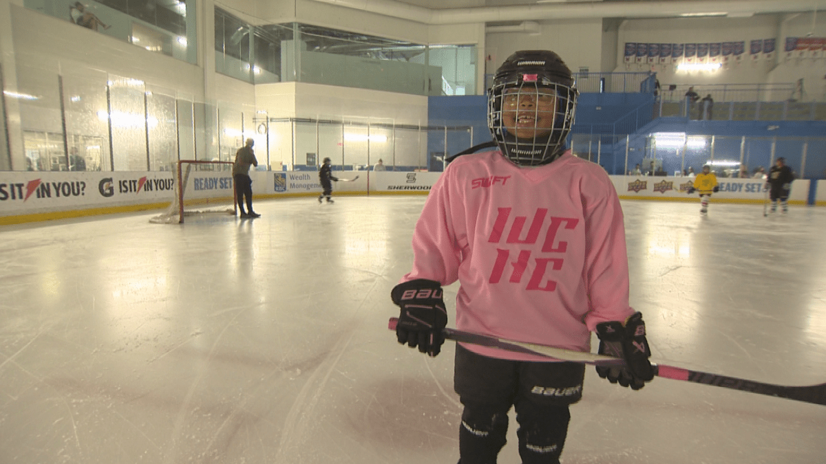 Eliyah King poses on the ice during the Women of Colour Hockey Collective Summer Camp.