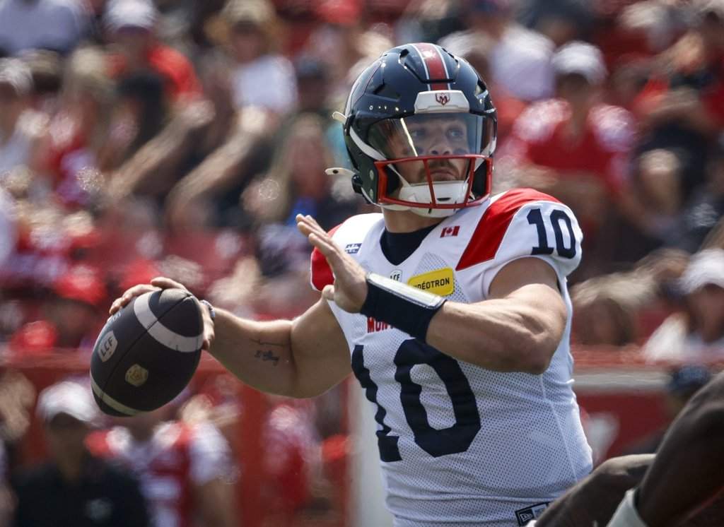 Montreal Alouettes quarterback Davis Alexander throws the football during first half CFL football action against the Calgary Stampeders, in Calgary, Saturday, July 18, 2026. THE CANADIAN PRESS/Jeff McIntosh.