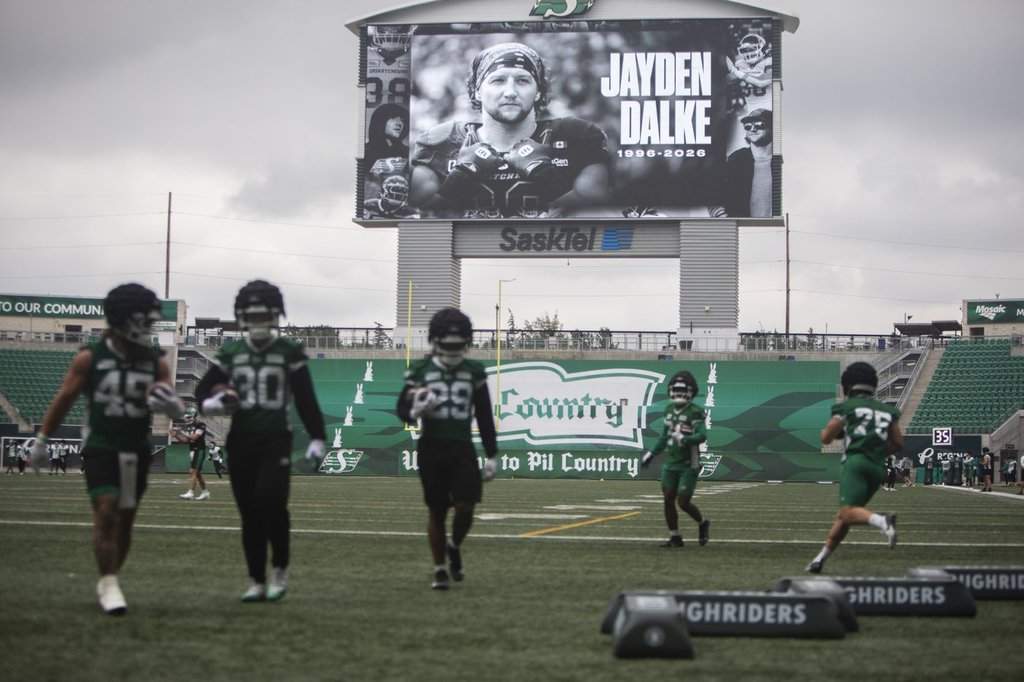 A tribute to Saskatchewan Roughriders player Jayden Dalke is shown on a video display during the Roughriders practice at Mosaic Stadium in Regina on Monday, July 20, 2026. 