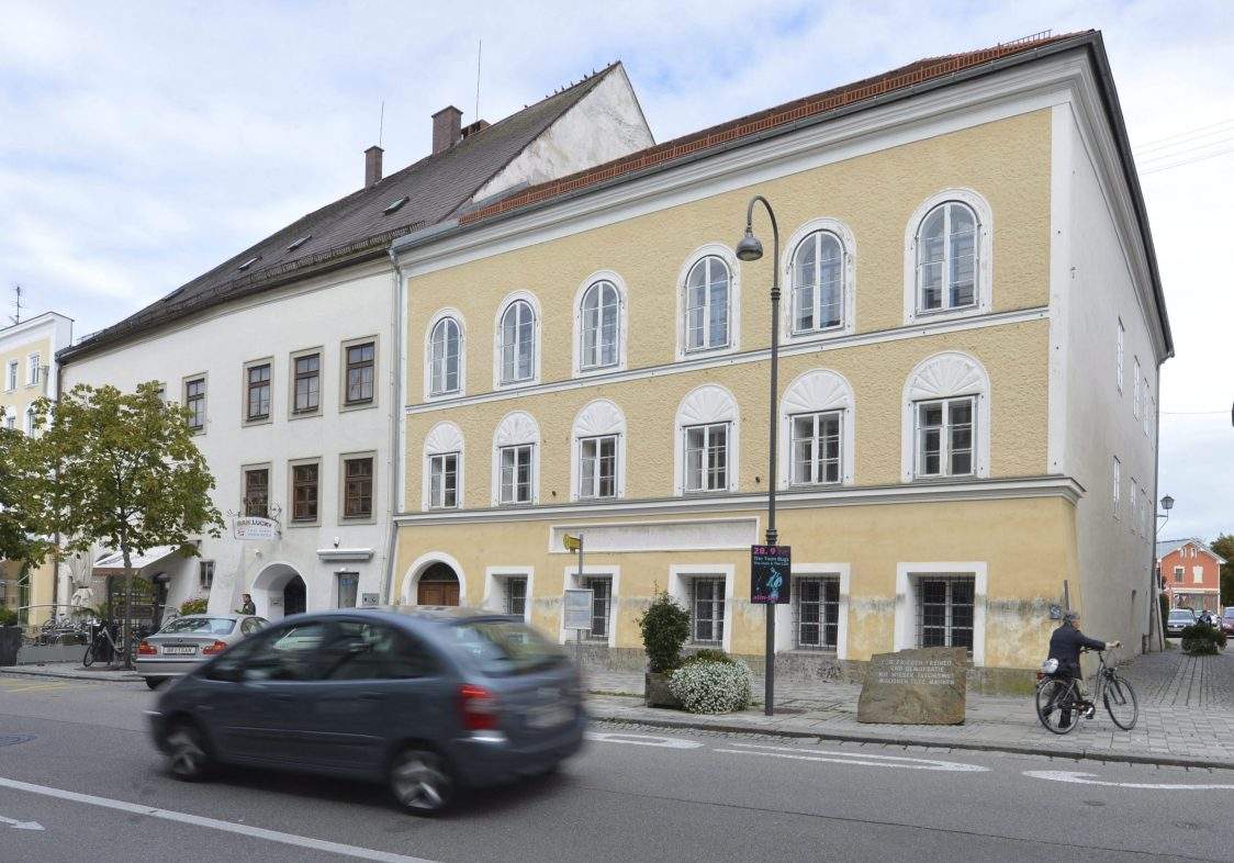 FILE - This Sept. 27, 2012 file picture shows an exterior view of Adolf Hitler's birth house , front, in Braunau am Inn, Austria. Austrian authorities say the house where Adolf Hitler was born in 1889 will become a police precinct, ending years of uncertainty over the building that's become a pilgrimage site for people who glorify the Nazi dictator.