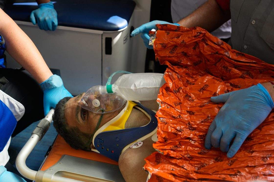 Rescue workers attend to Hernan Alberto Gil Flores after he was pulled from the rubble eight days after he was trapped by twin earthquakes that struck Catia La Mar, Venezuela, Thursday, July 2, 2026.