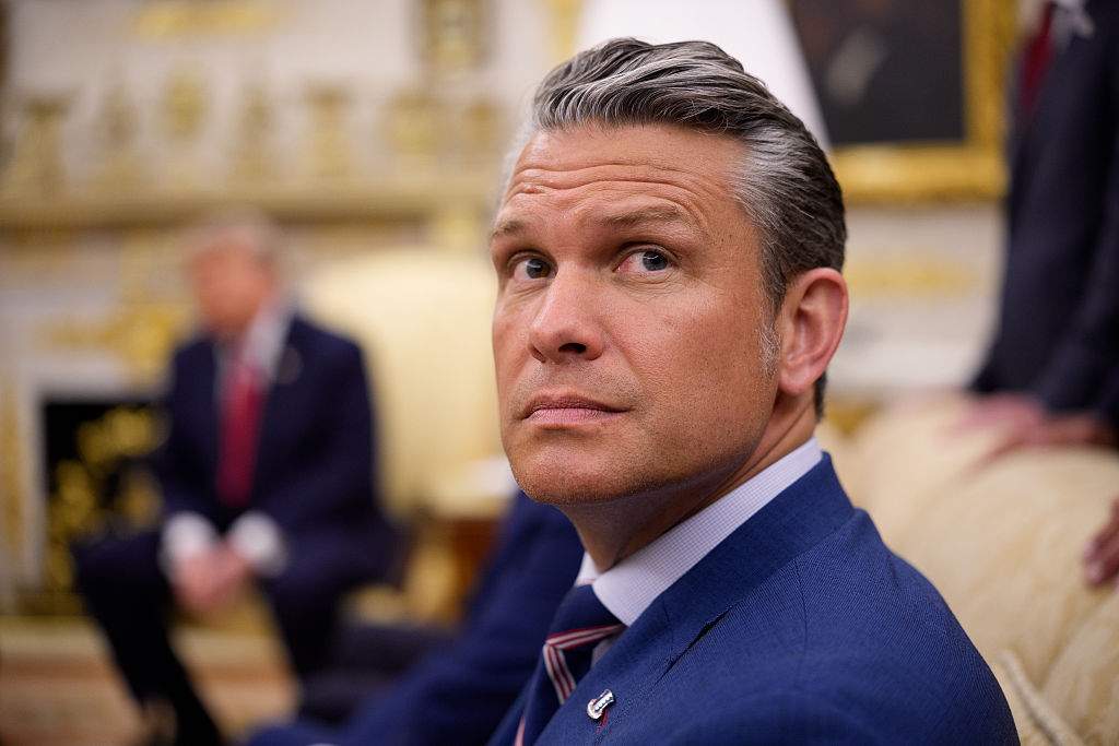Secretary of War Pete Hegseth attends a meeting with U.S. President Donald Trump and Prime Minister of Iraq Ali al-Zaidi in the Oval Office of the White House on July 14, 2026 in Washington, DC. In his first foreign trip since taking office, Zaidi is visiting the White House to hold talks on U.S. investment into the Iraqi economy amid instability in the region.