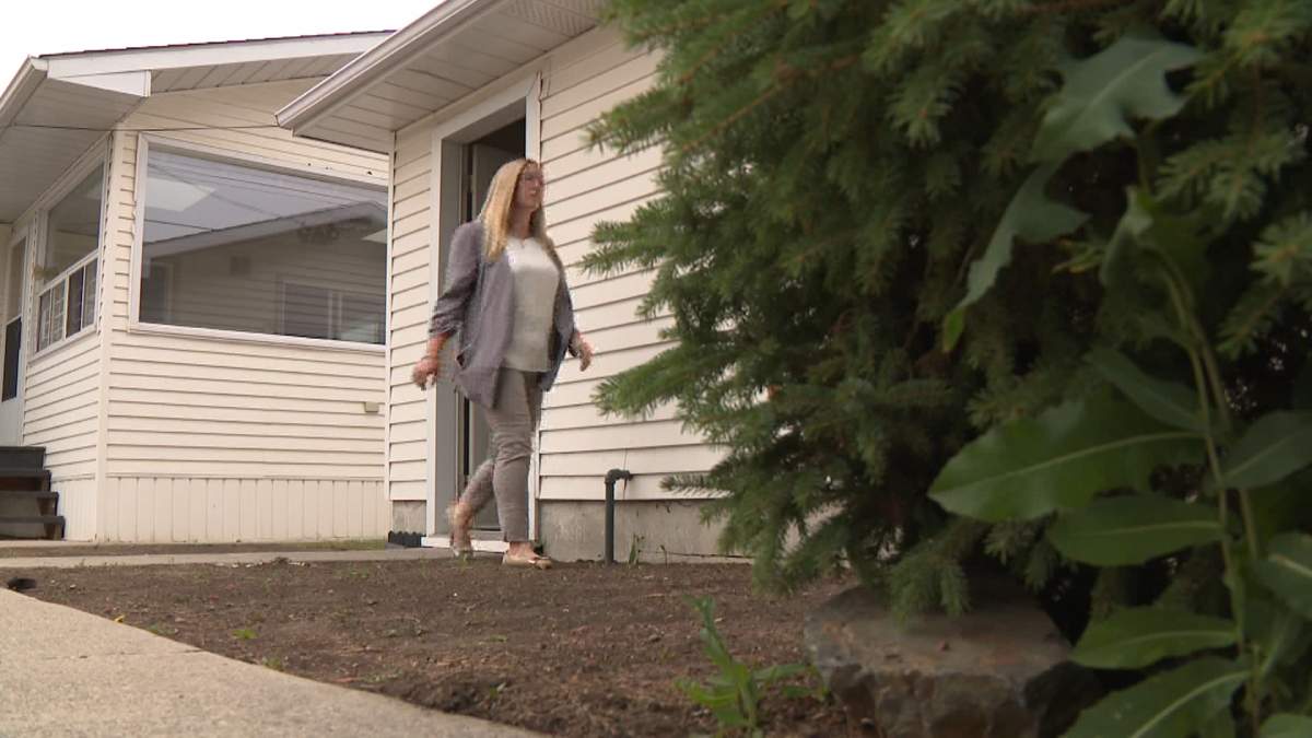 Calgary real estate agent, Justine Poirier, searches the confined areas of a property she has listed for sale, for any sign of the missing 11-year-old Calgary boy.