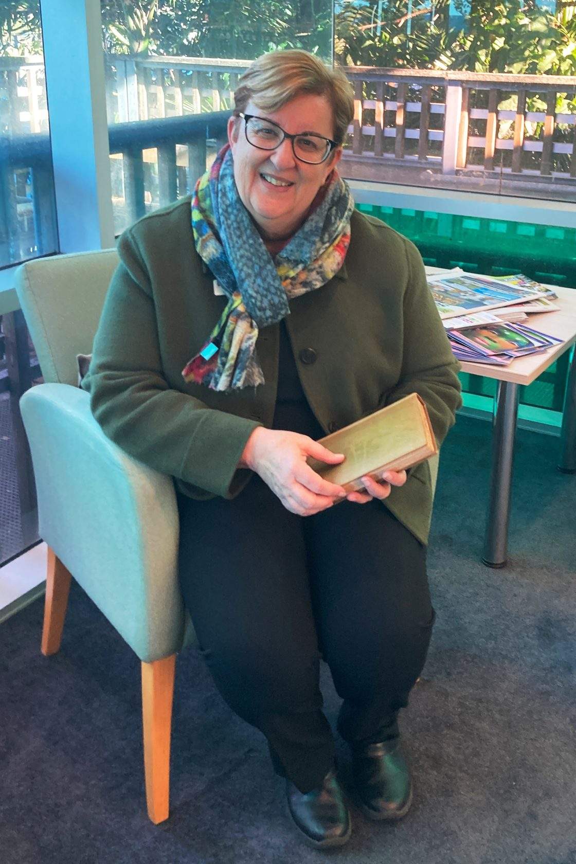 In this photo provided by Jane Thompson, library manager Michelle Hudson holds the book "Antiquities of Athens", after its return in Kiama, Australia, on Wednesday, July 29, 2026, an estimated 150 years late.