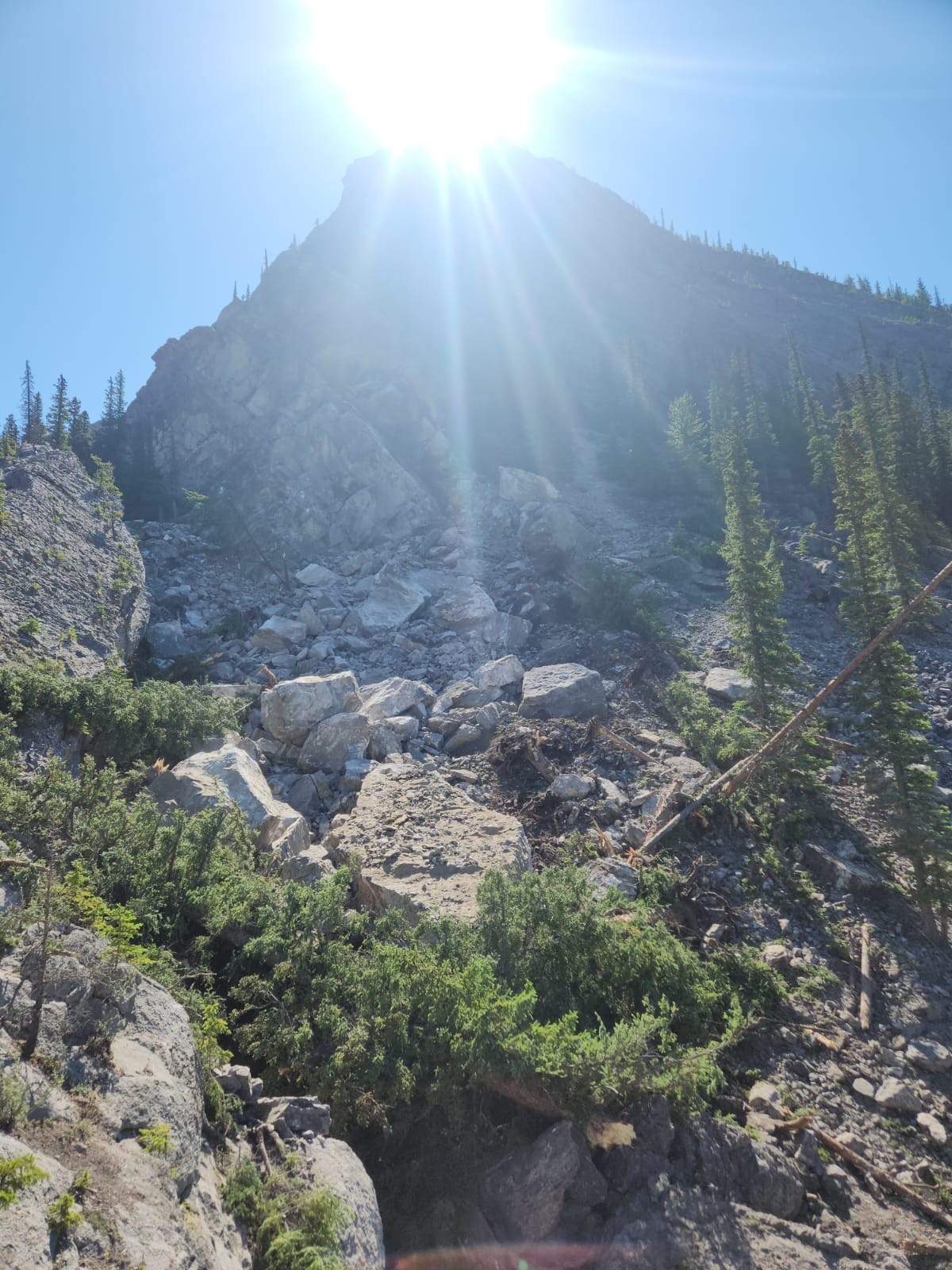 A photo of the area, provided by Parks Canada, shows a large number of boulders that appear to have came tumbling down in the popular climbing area.