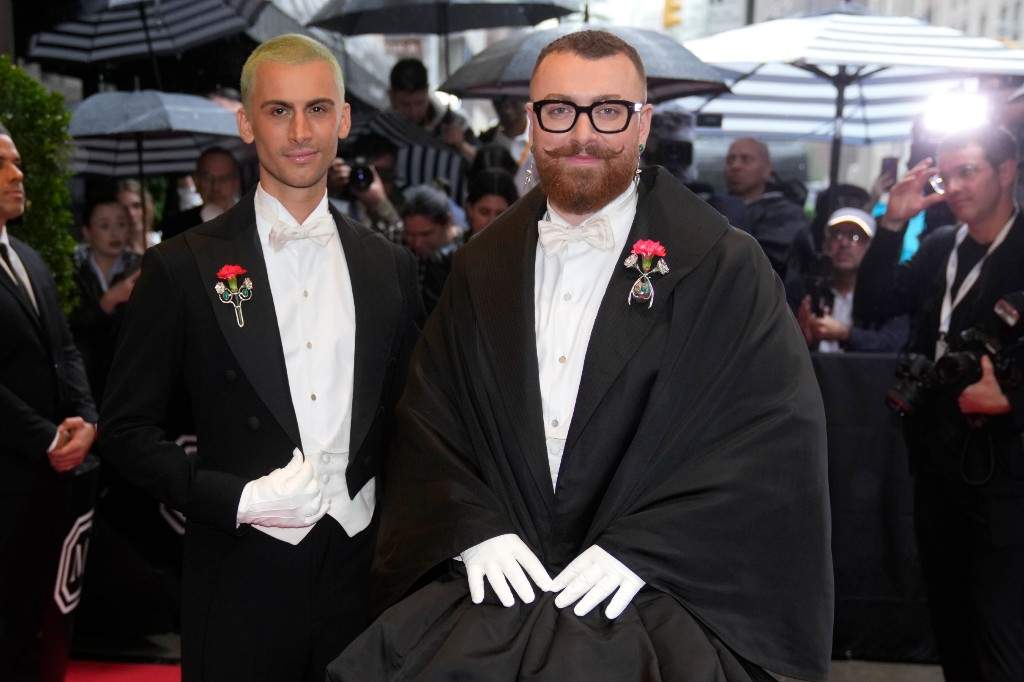 Christian Cowan, left, and Sam Smith depart The Mark Hotel prior to attending The Metropolitan Museum of Art's Costume Institute benefit gala on Monday, May 5, 2025, in New York.