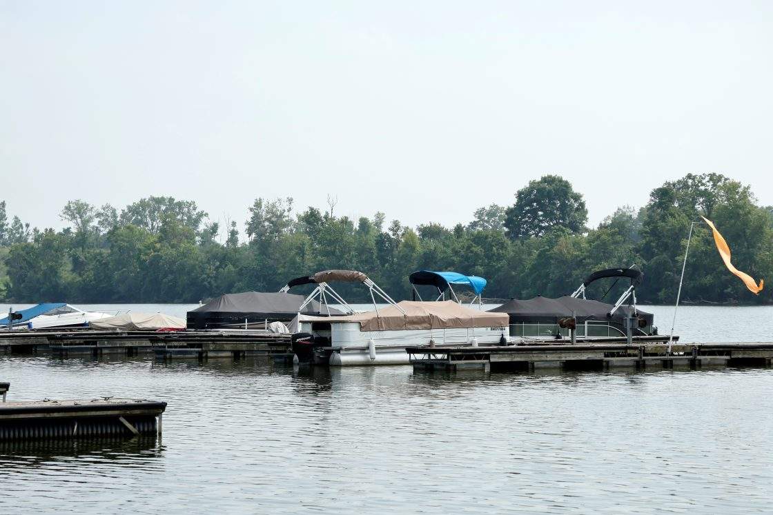 Boats sit moored on the Scioto River near where multiple people died after several of them entered the water to help a person who was struggling to swim, July 20, 2026, in Powell, Ohio.