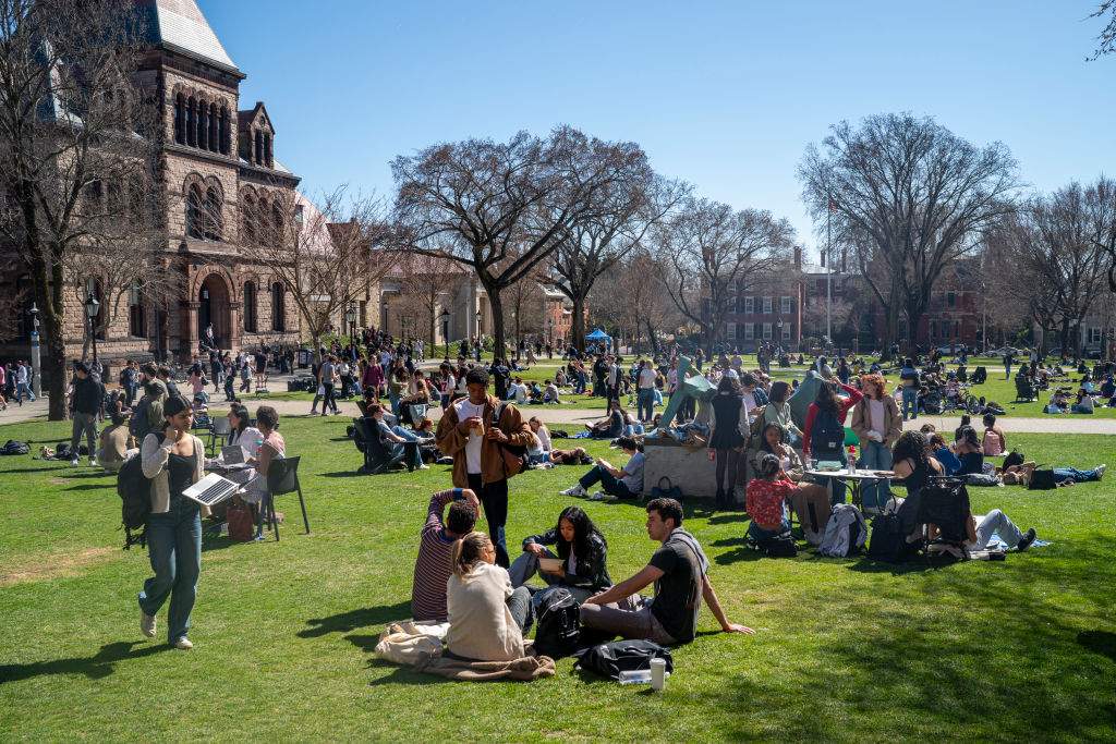 Students attending Brown University walk through the main campus March 19, 2025 in Providence, Rhode Island.