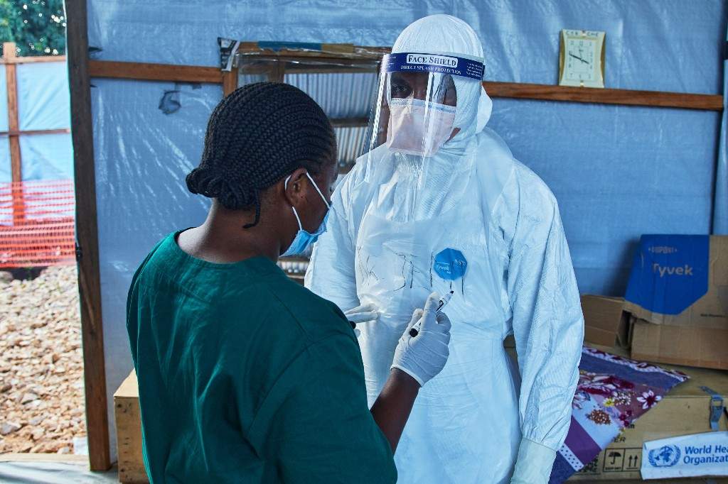 Health workers interact at the Evangelical Medical Center, in Bunia, eastern Congo, Friday, July 3, 2026, where Ebola clinical trials are scheduled to take place.