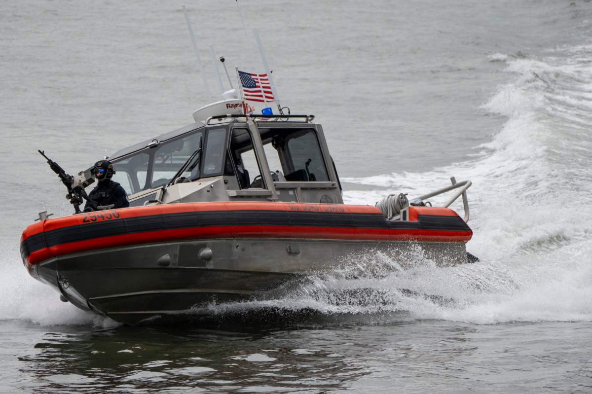 A U.S. Coast Guard boat moves on the East River near the United Nations Headquarters in New York, Sept. 22, 2025.