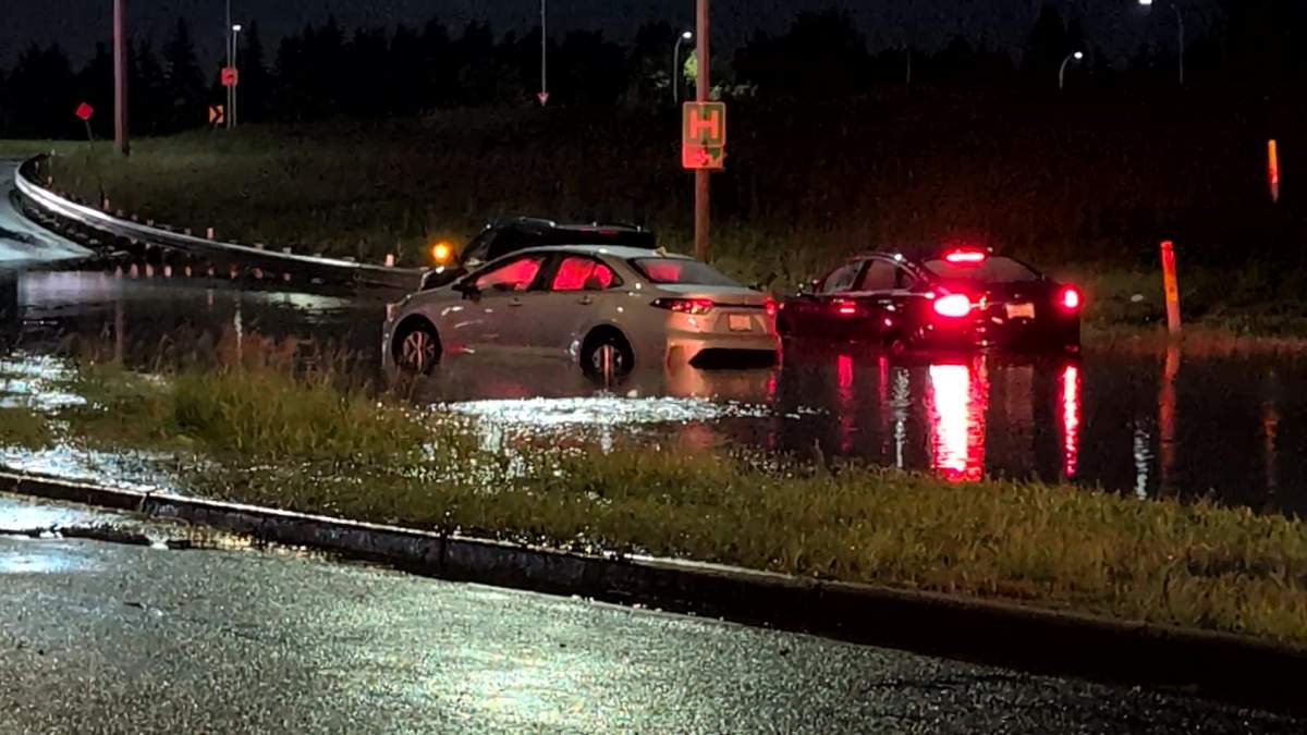 Vehicles stuck in high water on the Whitemud Drive eastbound off-ramp to 170 Street, which flooded during a thunderstorm on Saturday, July 25, 2026.