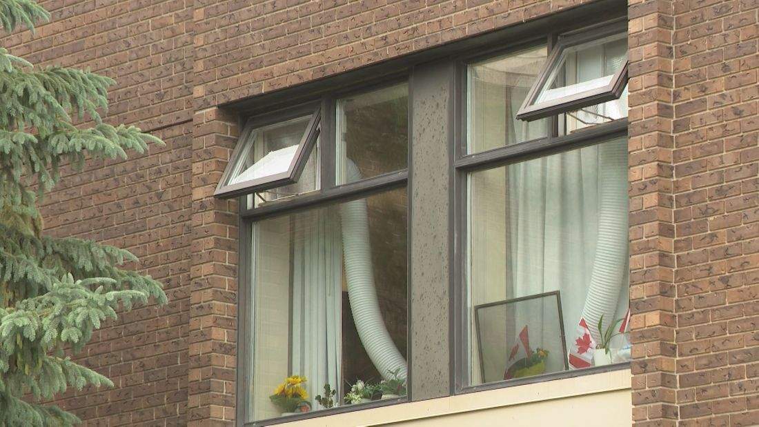 An air conditioning unit is visible through the window of a unit in Winnipeg's Donwood Manor Personal Care Home.