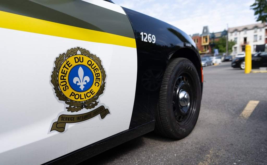 A Surete du Quebec police car parks outside headquarters in Montreal, Tuesday, Sept. 10, 2024.