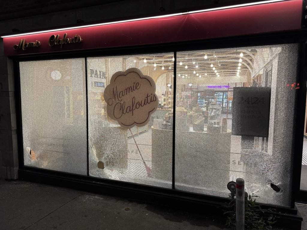 Broken windows are shown at the Mamie Clafoutis bakery in Montreal on August 3, 2026.