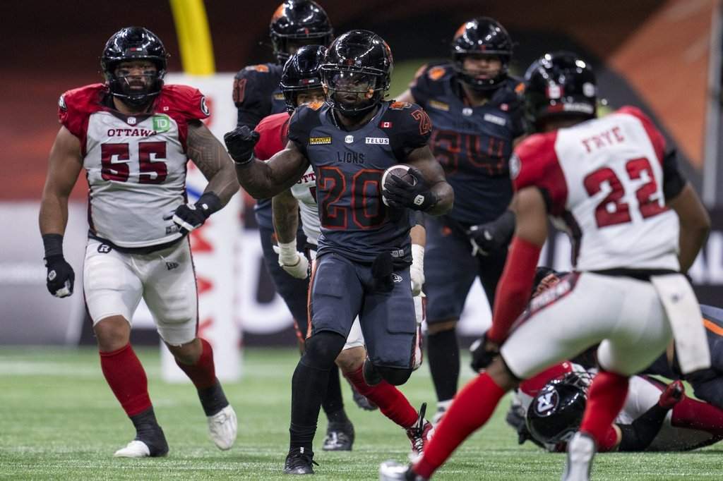 B.C. Lions running back James Butler (20) runs for yards against the Ottawa Redblacks during the second half of a CFL football game in Vancouver, on Friday, September 12, 2025. THE CANADIAN PRESS/Jimmy Jeong.