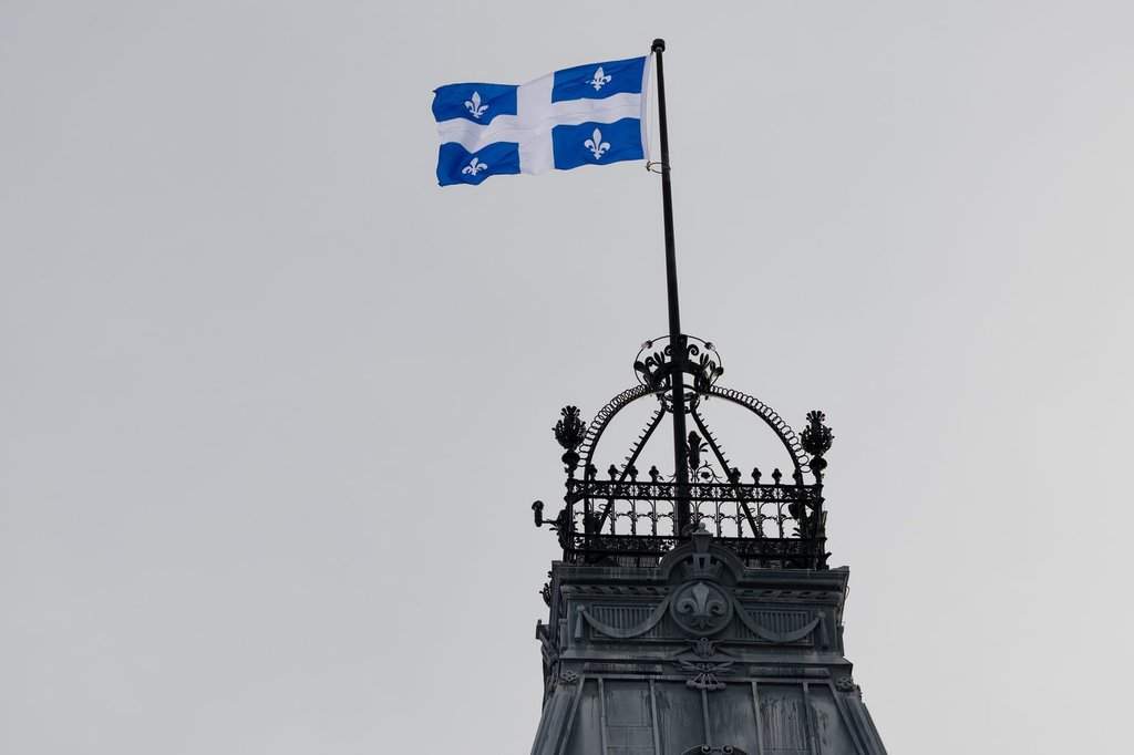 The Quebec Fleur-de-lis provincial flag flies on top of the National Assembly’s main tower, Wednesday, January 18, 2023 in Quebec City. The Fleur-de-lis will celebrate its 75th anniversary on Saturday. THE CANADIAN PRESS/Jacques Boissinot.