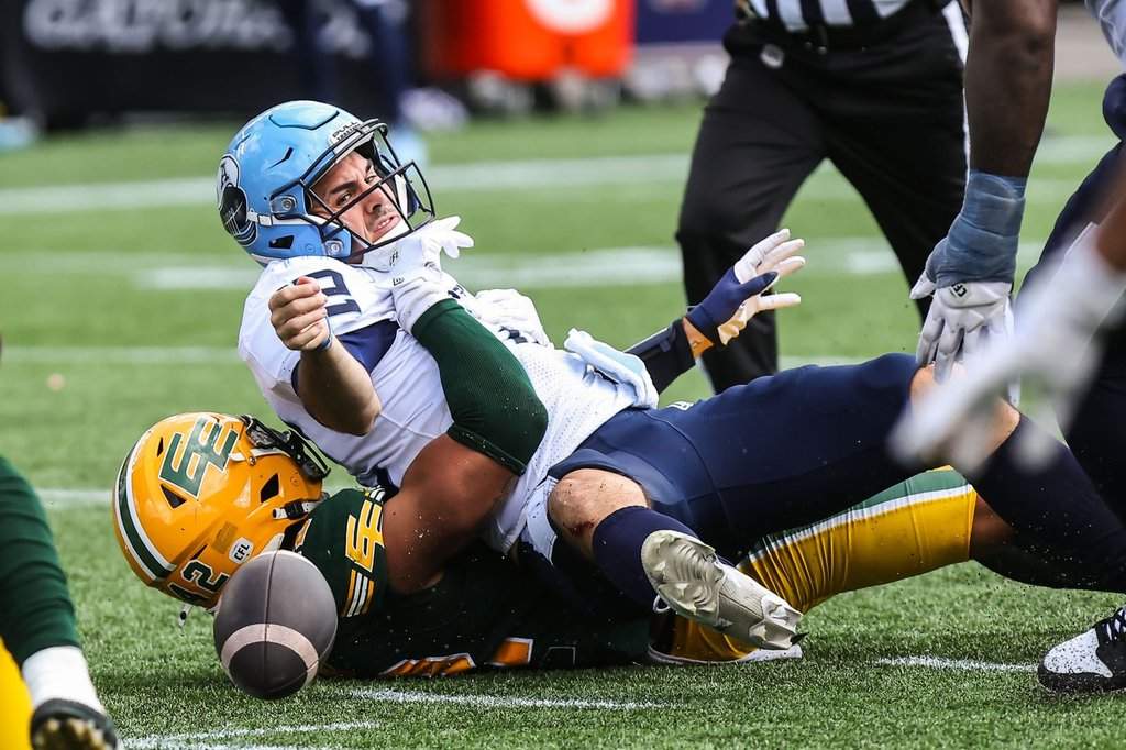 Edmonton Elks' Noah Taylor (42) sacks Toronto Argonauts' quarterback Chad Kelly (12) during second half CFL football action in Edmonton on Saturday, Aug. 15, 2026. THE CANADIAN PRESS/Codie McLachlan.