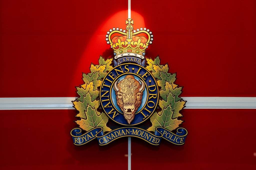 The RCMP crest hangs at a headquarters building in Surrey, B.C., on Wednesday, Feb. 11, 2026. 