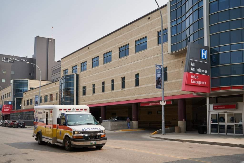 An ambulance drives past Health Sciences Centre in Winnipeg on Thursday, June 15, 2023.