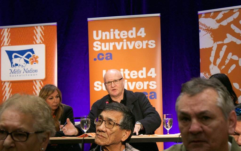 Survivors, including Louis Gardiner (back, centre) of a residential school that housed Métis children in Saskatchewan attend a media update event in Whitecap, Sask., Tuesday, Jan. 24, 2023. THE CANADIAN PRESS/Kelly Malone.