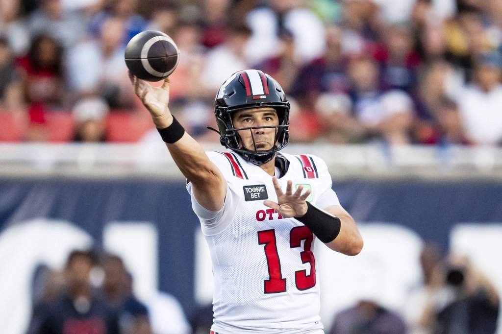 Ottawa Redblacks quarterback Jake Maier (13) throws the ball during first half CFL action against the Montreal Alouettes in Montreal on Aug. 20, 2026. THE CANADIAN PRESS/Christopher Katsarov.