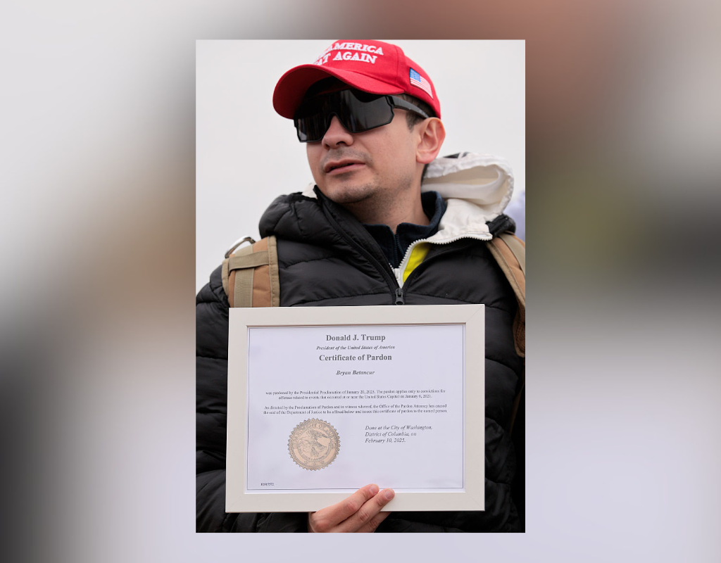 Bryan Betancur holds a Certificate of Pardon from President Donald Trump during a January 6th memorial march marking five years since the attack on January 06, 2026 in Washington, DC.