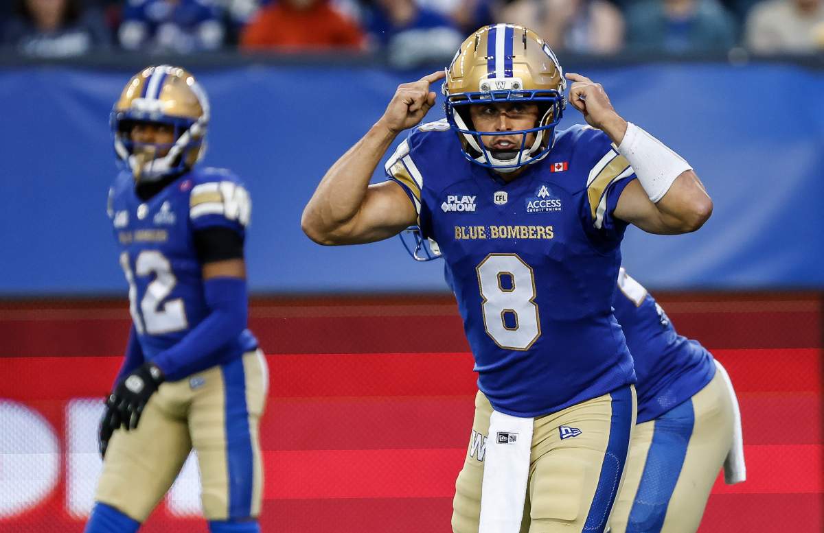 Winnipeg Blue Bombers quarterback Zach Collaros (8) signals to his receivers during first half CFL football action against the Montreal Alouettes in Winnipeg on Friday, August 28, 2026. THE CANADIAN PRESS/John Woods.