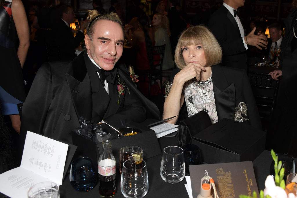 FILE: John Galliano and Editor-In-Chief of American Vogue and Chief Content Officer of Conde Nast Dame Anna Wintour attend a cocktail reception ahead of The Fashion Awards 2021 at Royal Albert Hall on November 29, 2021 in London, England.