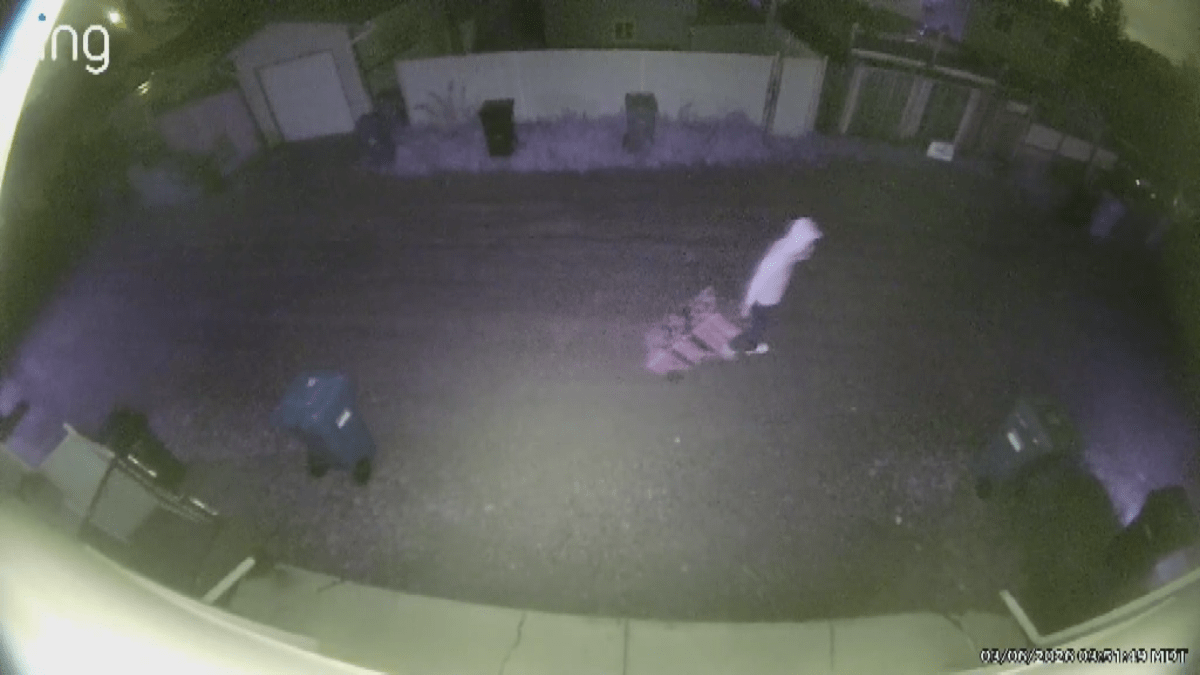 Man dragging toolboxes
