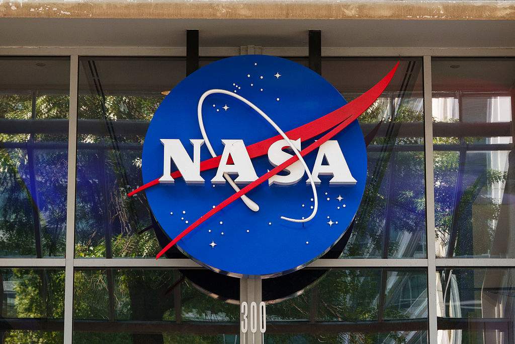 A NASA logo is displayed at the entrance to the Mary W. Jackson NASA Headquarters building on July 25, 2026 in Washington, DC.