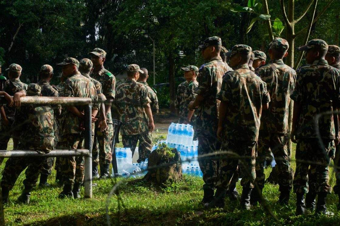 Nepalese army soldiers stand in the aftermath of flash floods in Devighat in the Nuwakot district in Nepal, Thursday, Aug 27, 2026.