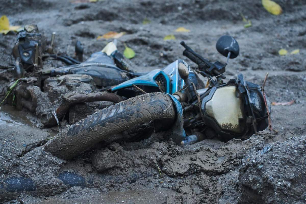 A two-wheeler lies in the aftermath of flash floods in Devighat in the Nuwakot district in Nepal, Thursday, Aug 27, 2026.