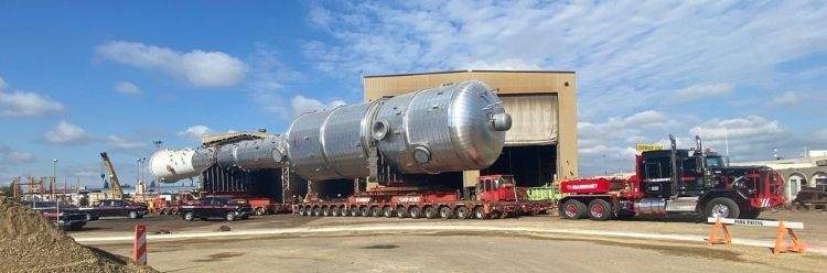 A massive de-ethanizer used in natural gas processing is on the move through central Alberta this week.