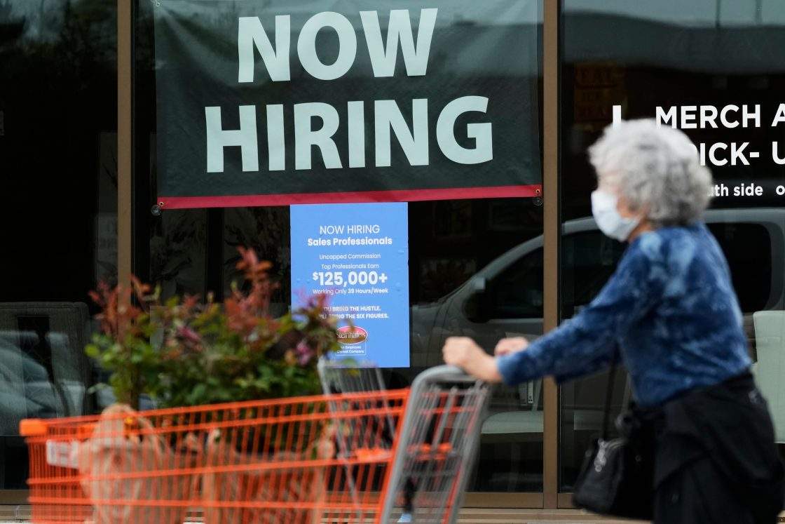FILE - Hiring sign for sales professionals is displayed at a store, in Vernon Hills, Ill., Wednesday, April 15, 2026. New data from the Labor Department shows employers shed 23,000 jobs in July.