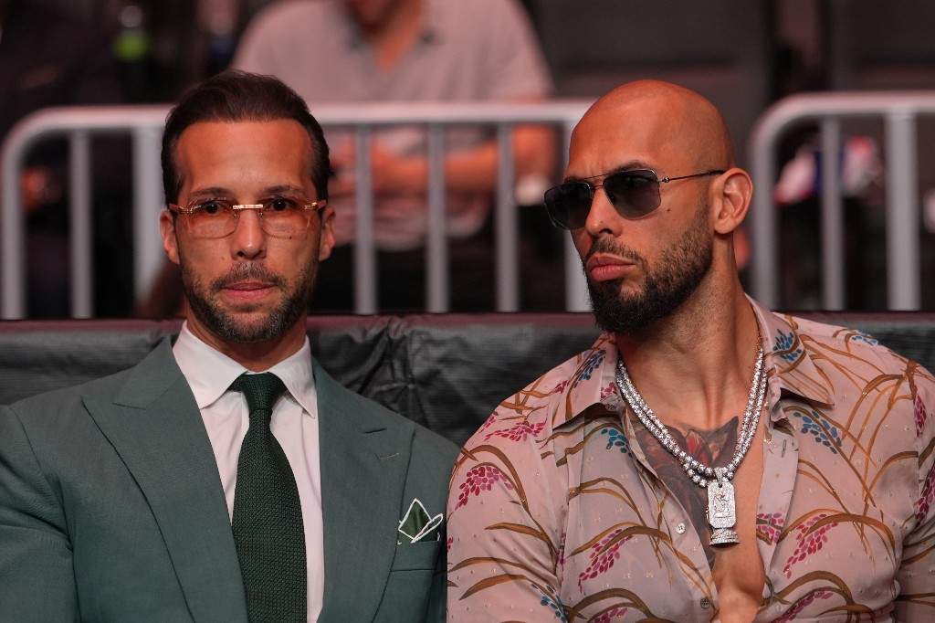 Andrew Tate, right, and his brother Tristan arrive before President Donald Trump to attend UFC 327 at Kaseya Center, Saturday, April 11, 2026, in Miami.