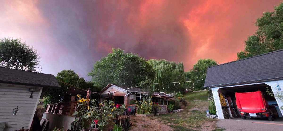 The Bald Range fire crested the hill behind the Milton home.