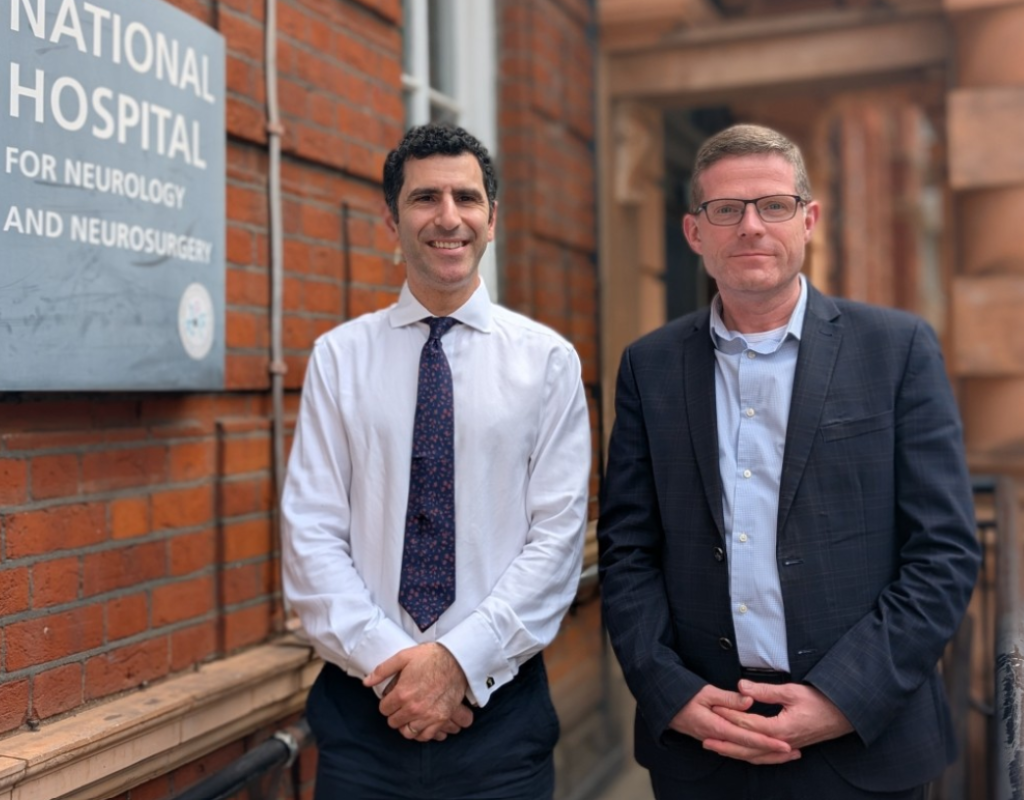 Patient Rhys Hibbert, (right) with neurosurgeon Hani Marcus, (left) was the first ever person to have a brain tumour successfully removed in an AI-assisted surgery.