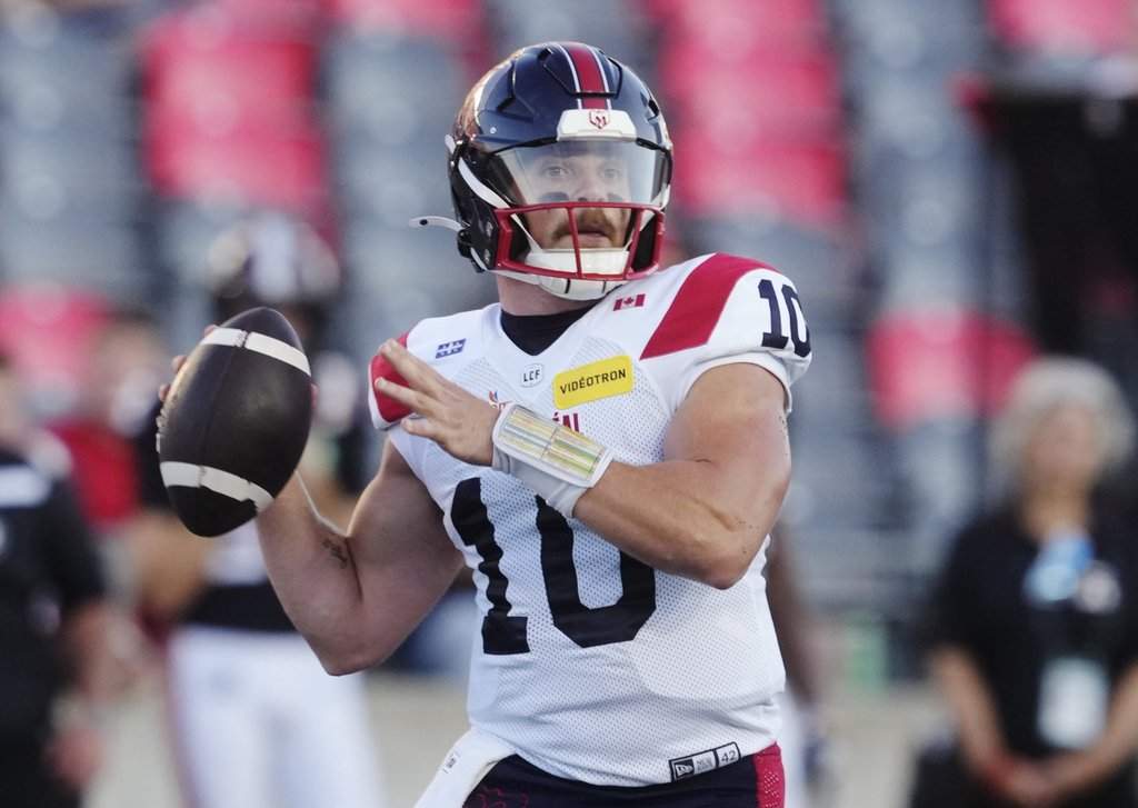 Montreal Alouettes quarterback Davis Alexander (10) attempts a pass against the Ottawa Redblacks during first half CFL action in Ottawa, Friday, July 31, 2026. THE CANADIAN PRESS/Adrian Wyld.