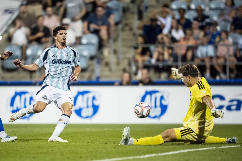 CF Montreal goalkeeper Sebastian Breza (1) makes a save on New England Revolution's Dor Turgeman (99) durins second half MLS soccer action in Montreal on Saturday, August 1, 2026. THE CANADIAN PRESS/Christopher Katsarov.