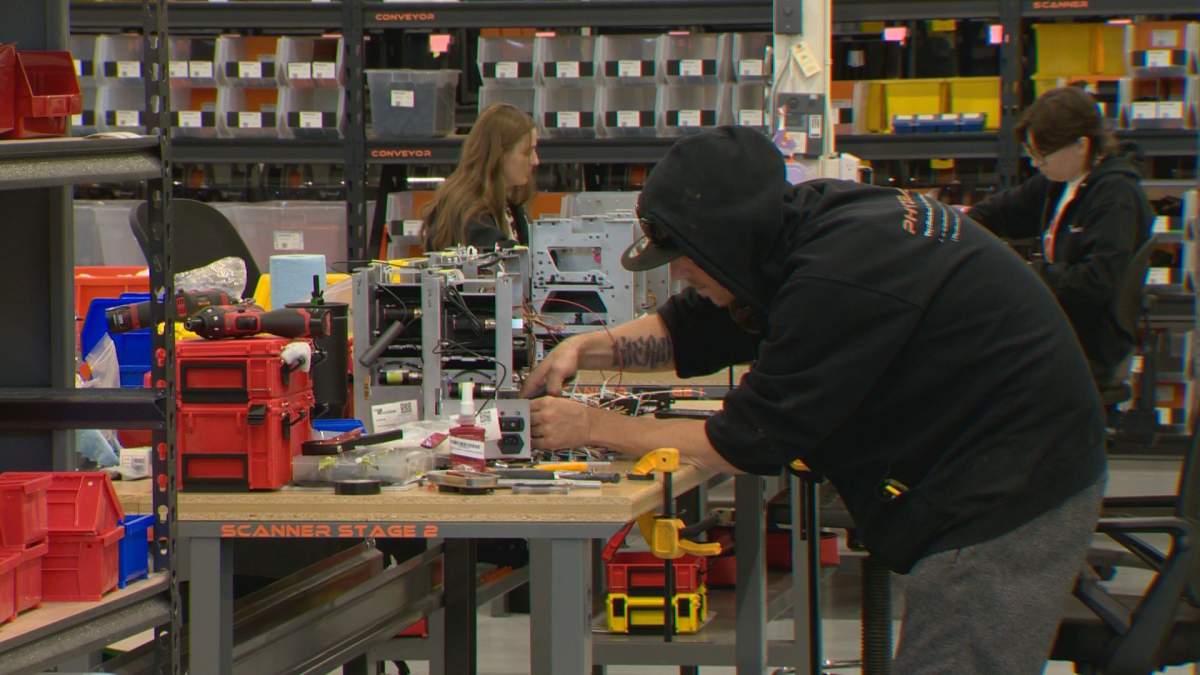 A employee works on a piece of equipment.