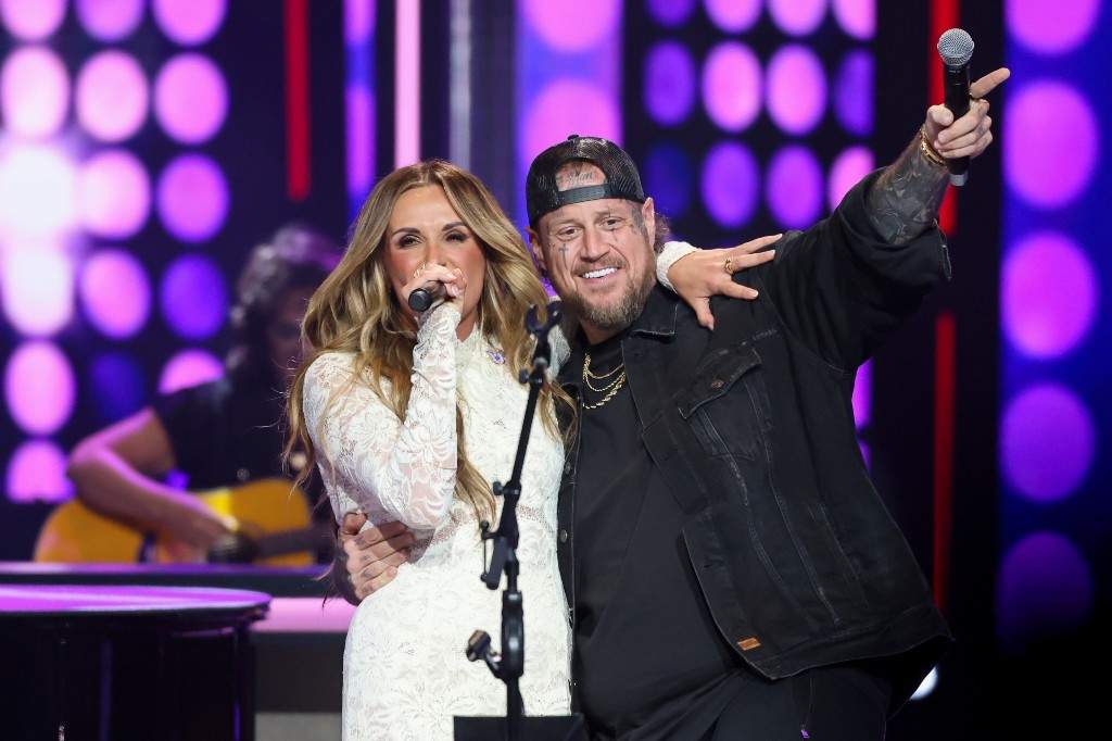 Jelly Roll makes a surprise appearance with Carly Pearce as she performs Dolly Parton's, '9 to 5,' during a show dedicated to the late Dolly Parton at the Grand Ole Opry, Saturday, Aug. 29, 2026, in Nashville, Tenn.