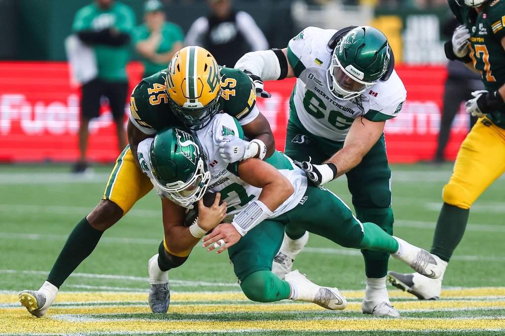 Edmonton Elks' Dariel Djabome (45) tackles Saskatchewan Roughriders quarterback Tommy Stevens (17) during second half CFL football action in Edmonton on Saturday, August 1, 2026. THE CANADIAN PRESS/Codie McLachlan.