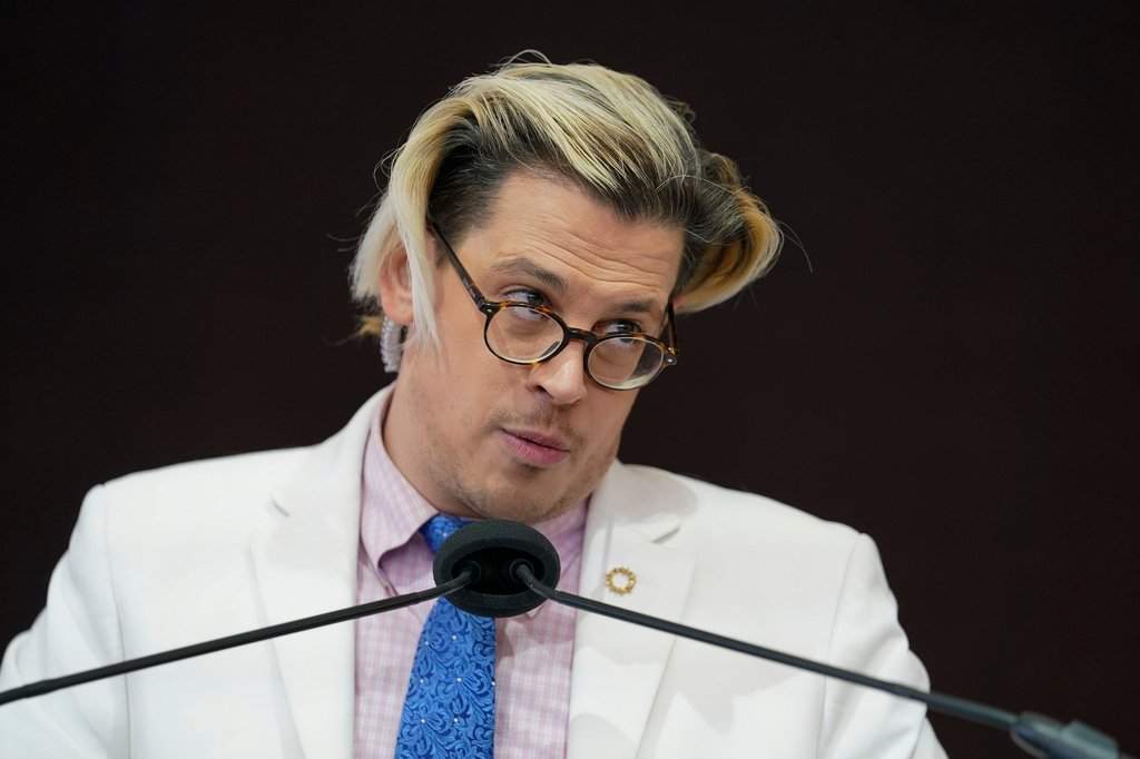 FILE - Activist Milo Yiannopoulos speaks during a rally outside of the Baltimore hotel where the United States Conference of Catholic Bishops are holding its Fall General Assembly meeting in Baltimore, Nov. 16, 2021. 