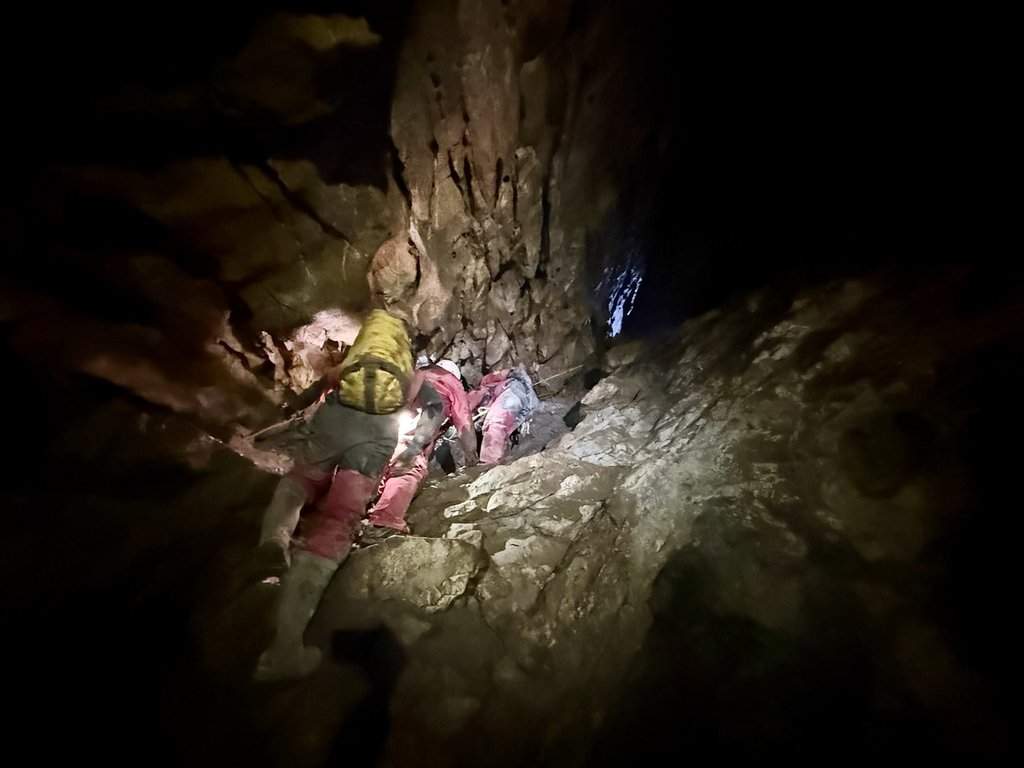 Search and Rescue Alberta and Alberta/BC Cave Rescue members along with Canmore Fire Rescue prepare to rescue a caver trapped in Rat's Nest Cave, in Canmore, Alta., in this Aug. 15, 2026 handout photo. THE CANADIAN PRESS/Handout - Search and Rescue Alberta (Mandatory Credit).