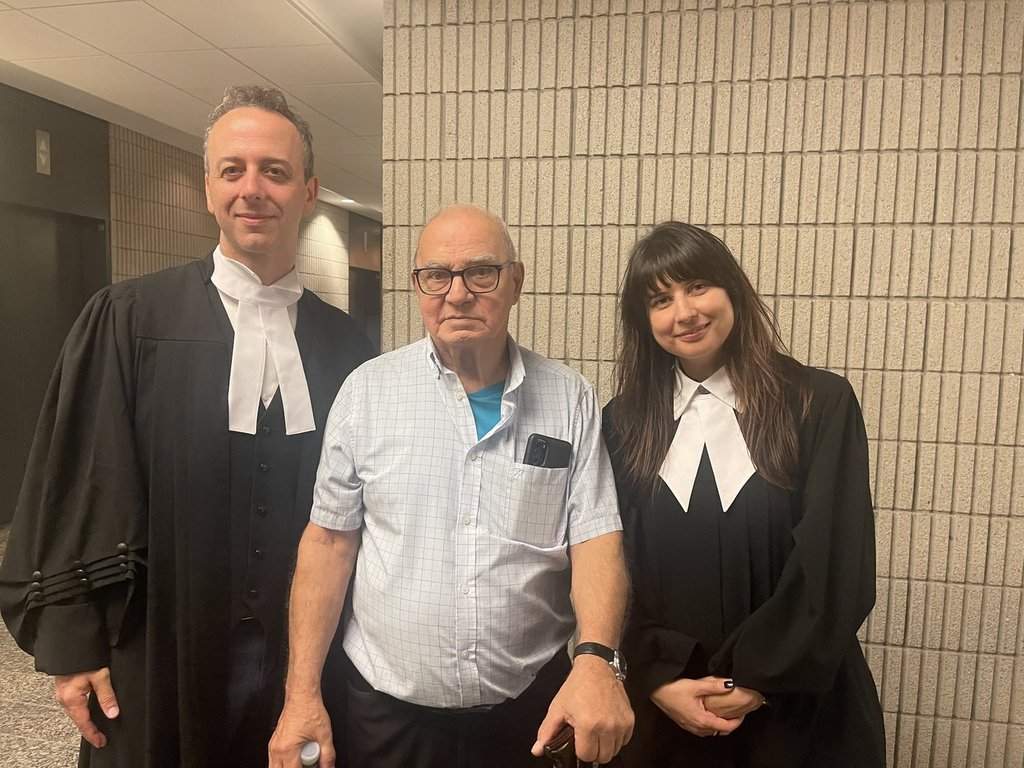 Claude Paquin, centre, is flanked by lawyers Nicholas St-Jacques and Julie Harinen at the Montreal courthouse on Wednesday, Nov. 6, 2024 after a judge overturned his conviction in connection with the 1978 murder of two people.